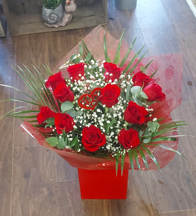 The Classic Devotion - A timeless classic bouquet of 12 long stemmed Freedom roses know for their rich red petals and long lasting freshness. There is no symbol of love more iconic than a dozen deep red roses. Hand selected for there velvet petals and sturdy stems these premium blooms are designed to express what words cannot. "I love you" delivered stright to their door. 